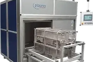Plasma system for production. Example showing rotating drum system for treatment of bulk parts